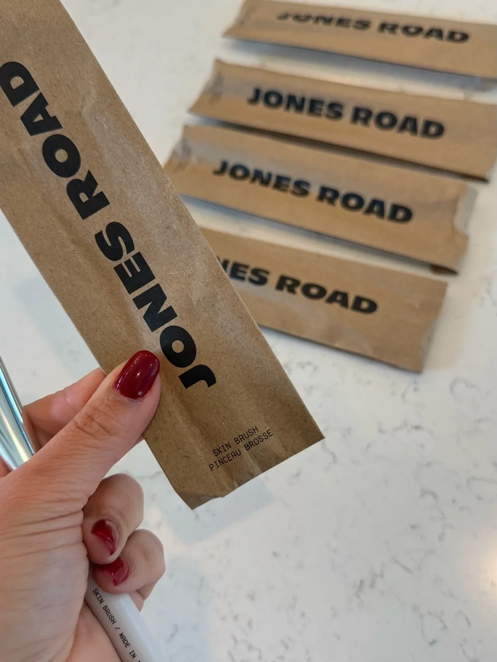 Jones Road Skin Brush with Soft White Handle and Natural Bristles